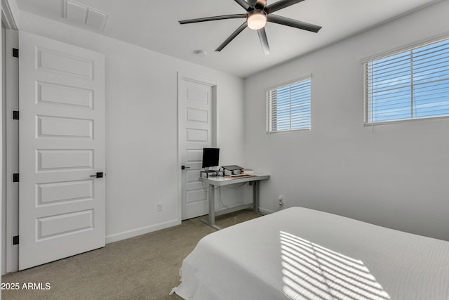 bedroom featuring baseboards, visible vents, and carpet flooring