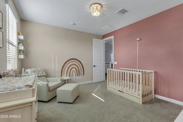 bedroom with multiple windows, carpet flooring, and visible vents