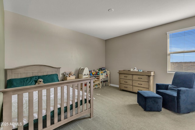 bedroom with carpet floors and baseboards