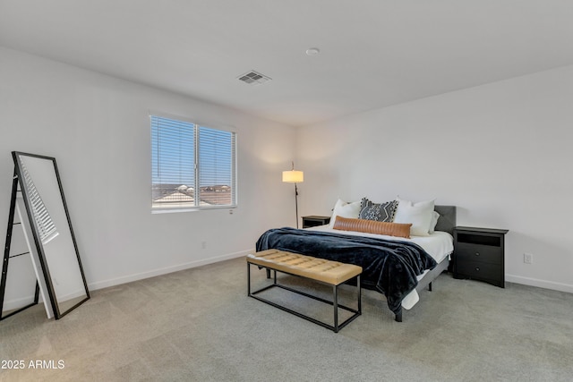 bedroom with carpet, visible vents, and baseboards