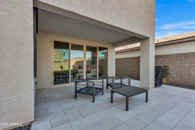 view of patio featuring fence