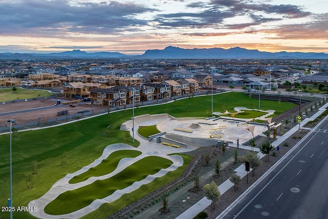 aerial view at dusk with a residential view and a mountain view