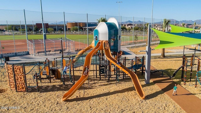 communal playground featuring a mountain view