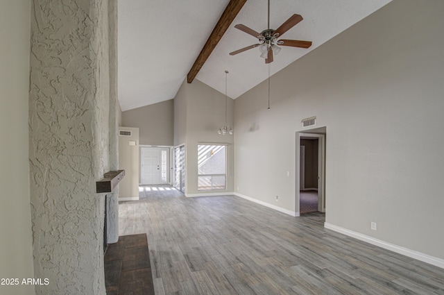 unfurnished living room with beamed ceiling, wood-type flooring, high vaulted ceiling, and ceiling fan