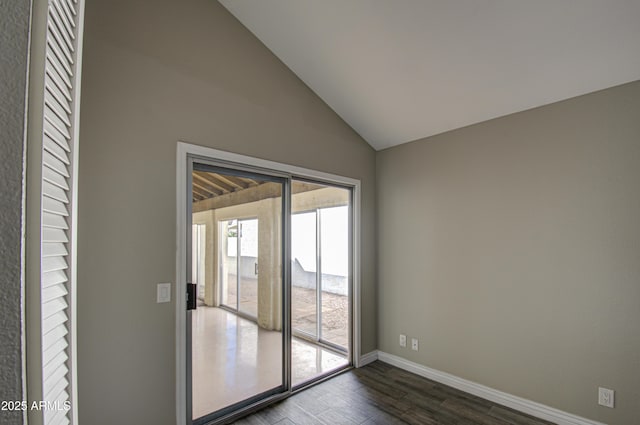 interior space featuring lofted ceiling and dark hardwood / wood-style floors