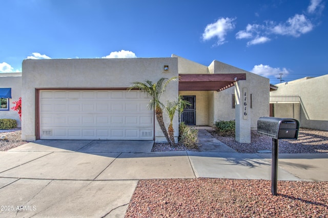 southwest-style home featuring a garage