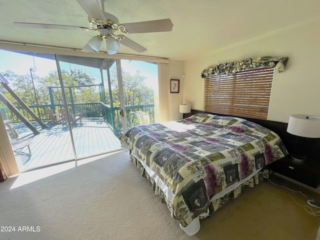 carpeted bedroom with ceiling fan, multiple windows, and access to exterior