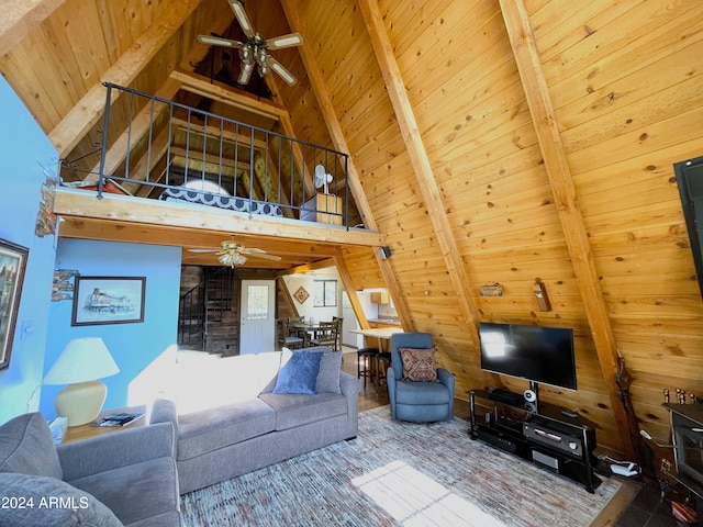 living room with ceiling fan, beam ceiling, wooden ceiling, and high vaulted ceiling