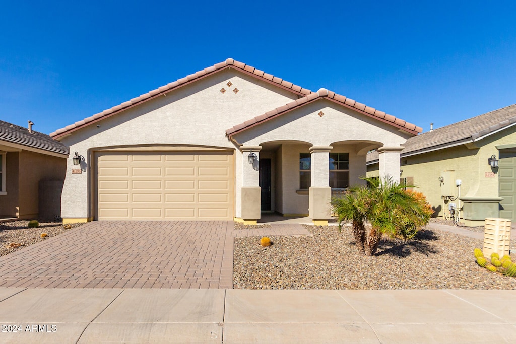 view of front of property with a garage