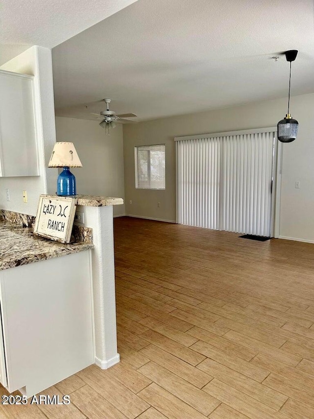 15225 N 100th St Unit 1220, Scottsdale, AZ 85260 - spare room with light wood-style floors, baseboards, and ceiling fan