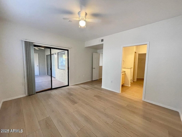 15225 N 100th St Unit 1220, Scottsdale, AZ 85260 - unfurnished bedroom with access to outside, baseboards, and light wood-style floors