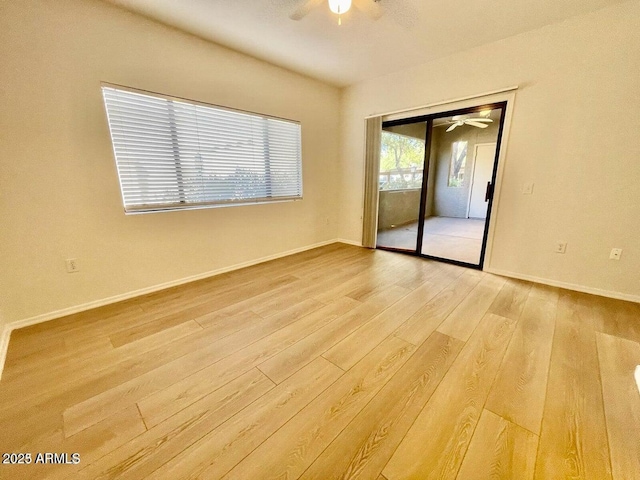 15225 N 100th St Unit 1220, Scottsdale, AZ 85260 - spare room with light wood-style floors, baseboards, and a ceiling fan