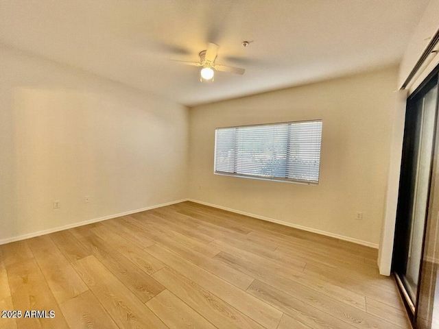 15225 N 100th St Unit 1220, Scottsdale, AZ 85260 - unfurnished room with ceiling fan, baseboards, and light wood-type flooring