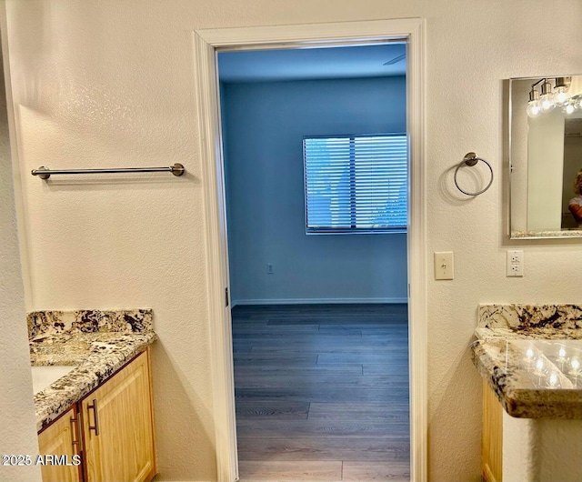 15225 N 100th St Unit 1220, Scottsdale, AZ 85260 - bathroom featuring baseboards and wood finished floors