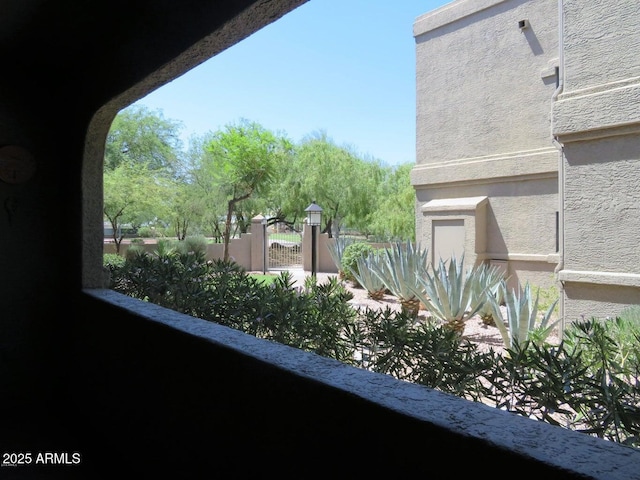 15225 N 100th St Unit 1220, Scottsdale, AZ 85260 - exterior details with a gate and stucco siding