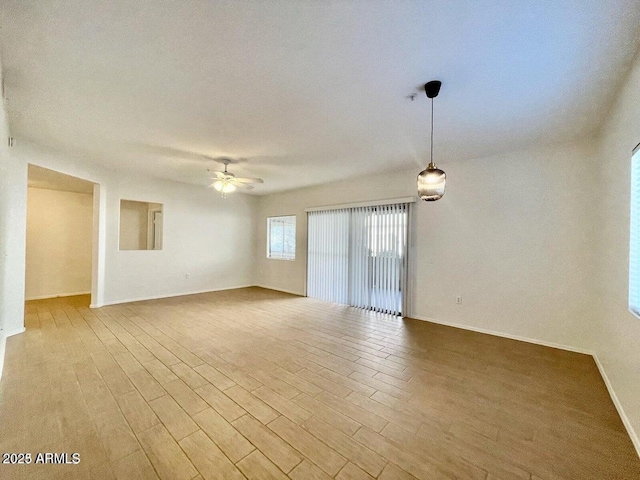 15225 N 100th St Unit 1220, Scottsdale, AZ 85260 - empty room with a ceiling fan, baseboards, and wood finished floors