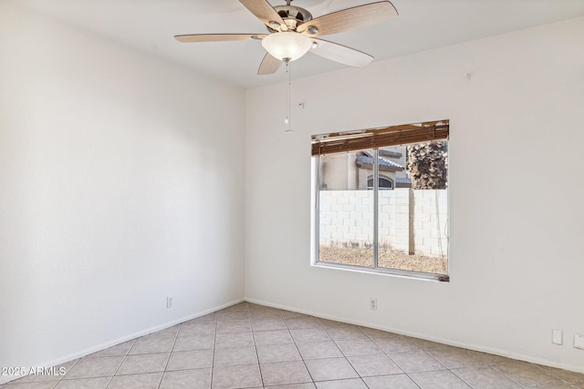 tiled empty room with ceiling fan