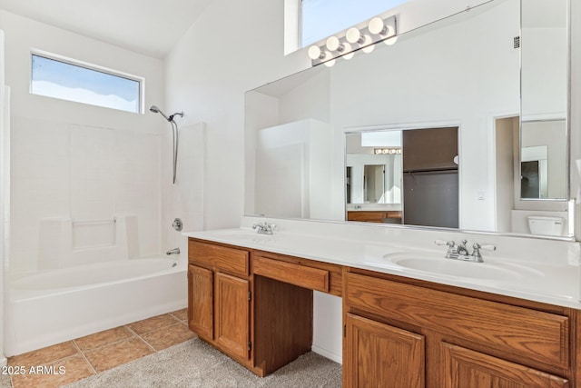 bathroom with vanity, shower / bathtub combination, and tile patterned floors