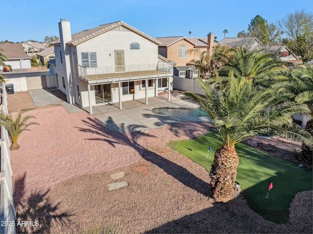 rear view of property with a patio