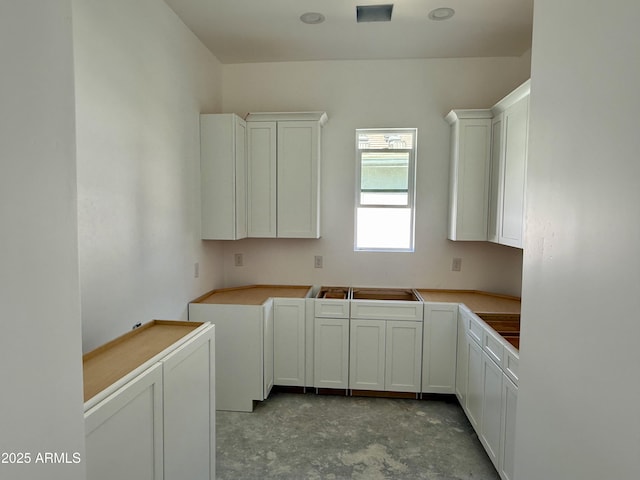 kitchen featuring white cabinets