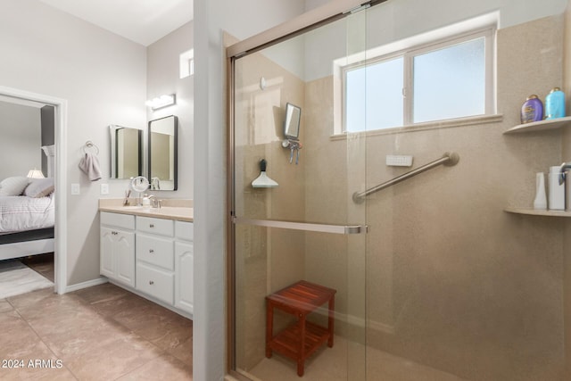 bathroom featuring vanity and a shower with shower door