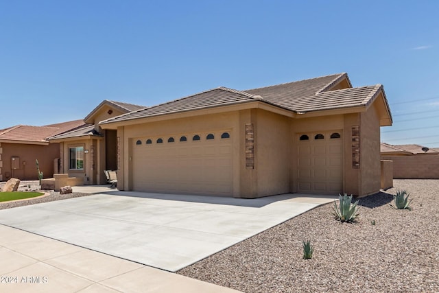 ranch-style home featuring a garage