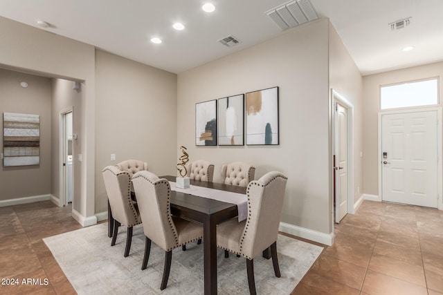 dining area featuring light tile patterned flooring