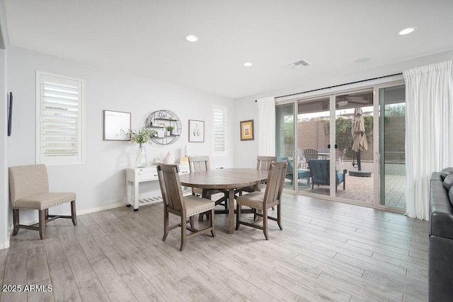 dining room featuring baseboards, recessed lighting, visible vents, and light wood-style floors