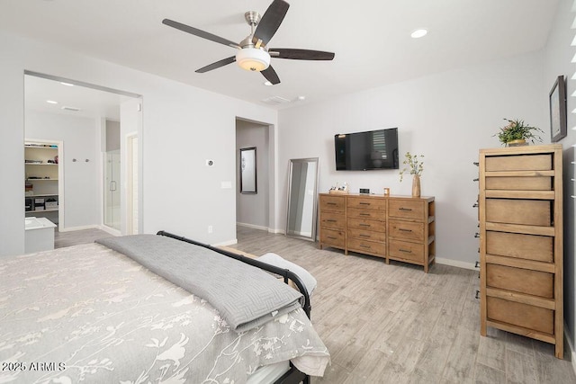 bedroom featuring light wood finished floors, baseboards, and a ceiling fan