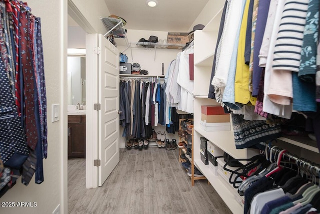 spacious closet with wood finished floors