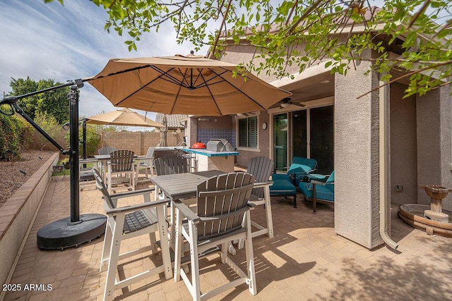 view of patio / terrace with outdoor dining area and fence