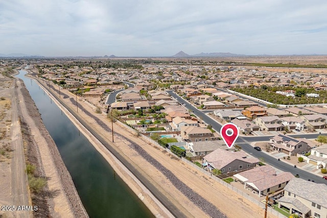 bird's eye view with a water view and a residential view