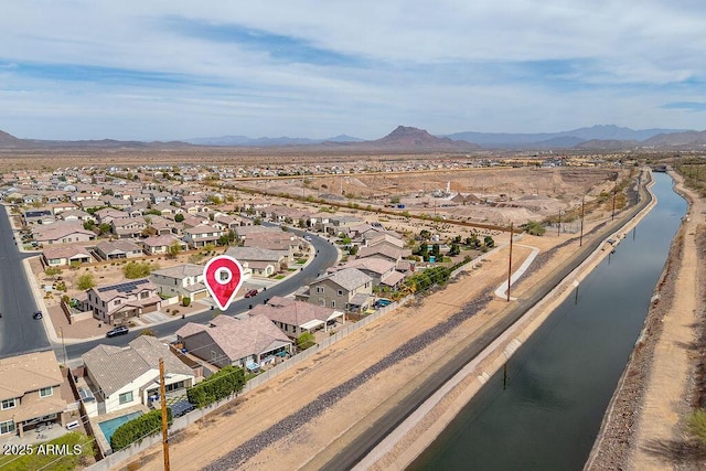 aerial view with a residential view and a water and mountain view