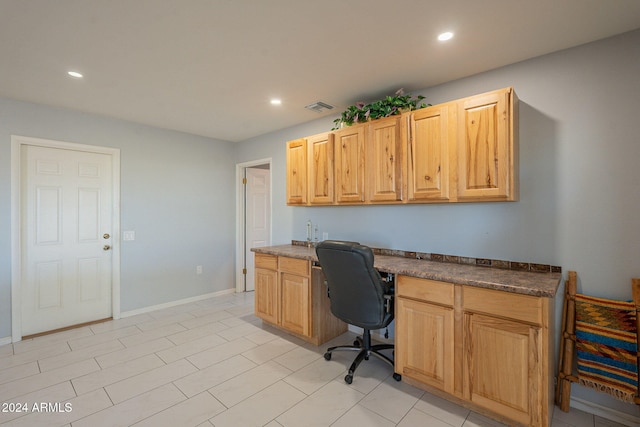 tiled office space with built in desk