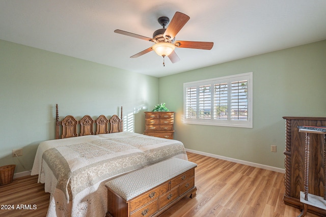 bedroom featuring light wood-type flooring and ceiling fan