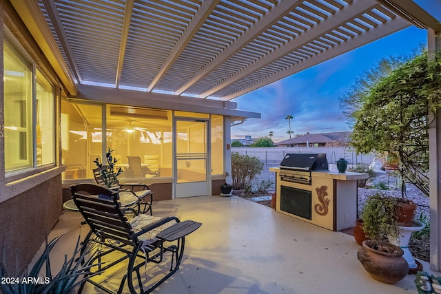 view of patio / terrace featuring exterior kitchen, area for grilling, and a pergola