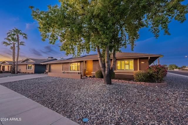 single story home with a garage