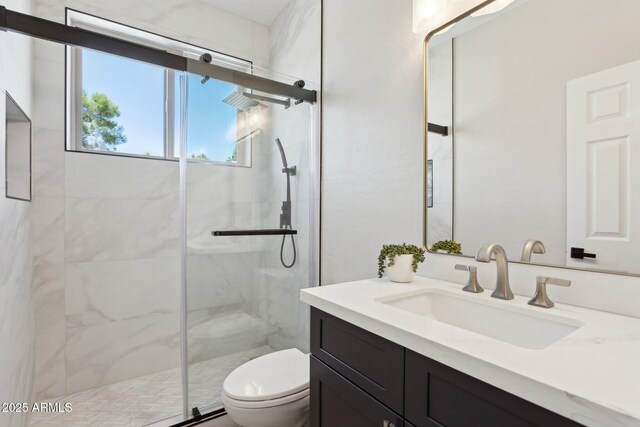 3202 E Orange Dr, Phoenix, AZ 85018 - bathroom featuring toilet, a marble finish shower, and vanity