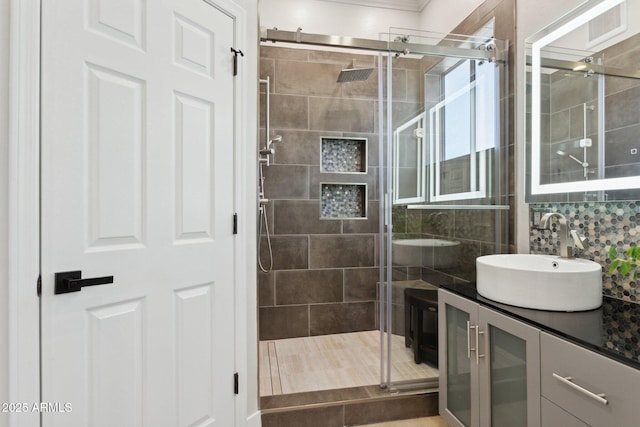 3202 E Orange Dr, Phoenix, AZ 85018 - bathroom featuring a stall shower, vanity, and decorative backsplash
