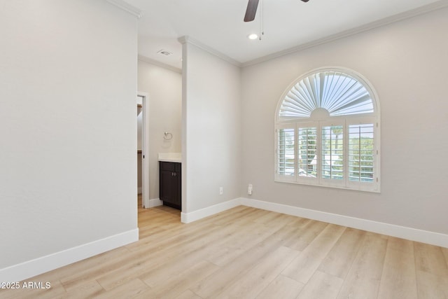 3202 E Orange Dr, Phoenix, AZ 85018 - spare room with ornamental molding, a ceiling fan, plenty of natural light, light wood-style floors, and baseboards