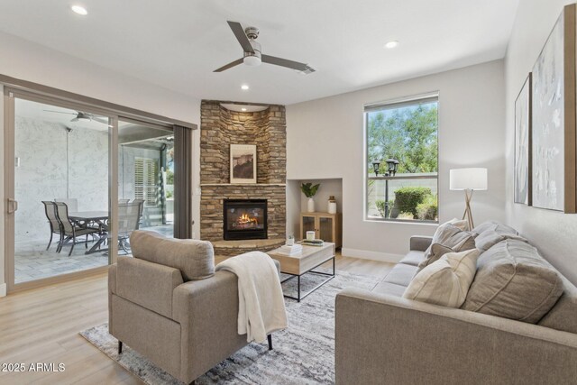 3202 E Orange Dr, Phoenix, AZ 85018 - living area featuring a ceiling fan, light wood finished floors, recessed lighting, baseboards, and a stone fireplace