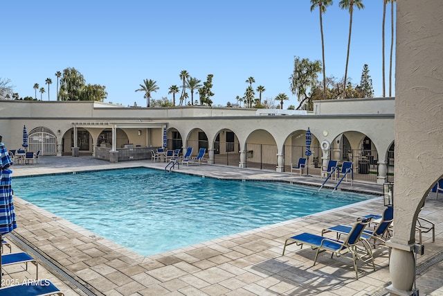 view of swimming pool with a patio area