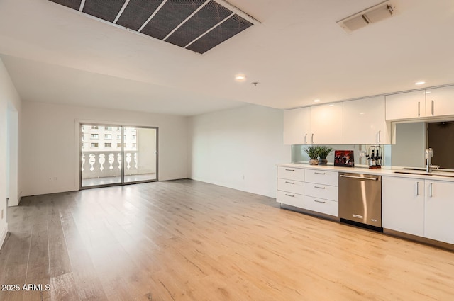 kitchen with white cabinetry, sink, dishwasher, and light wood-type flooring