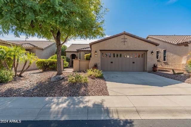 mediterranean / spanish-style home featuring a garage