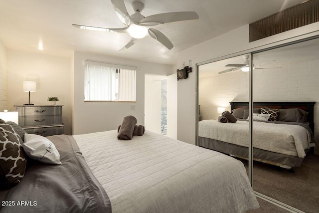 carpeted bedroom with a closet and a ceiling fan