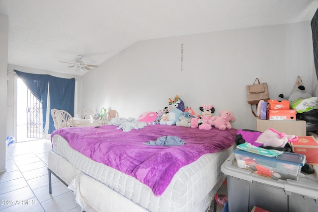bedroom with tile patterned floors, access to exterior, ceiling fan, and vaulted ceiling