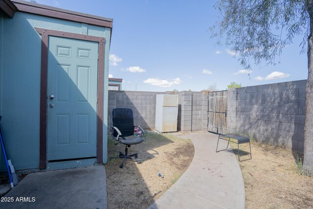 exterior space featuring a gate and fence