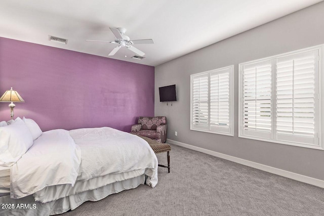 carpeted bedroom with ceiling fan