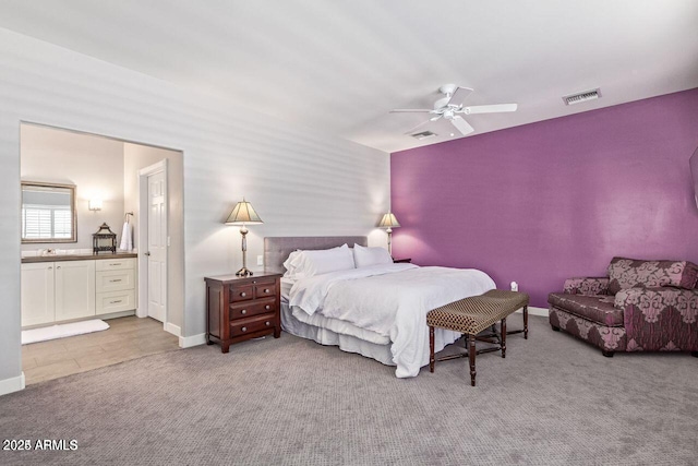 bedroom with ceiling fan and light carpet