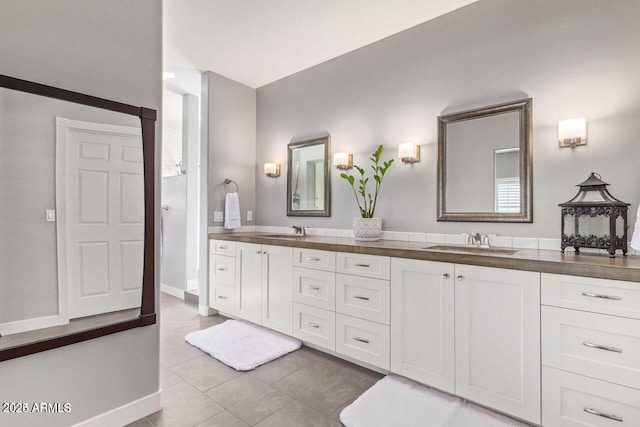 bathroom featuring tile patterned floors and vanity